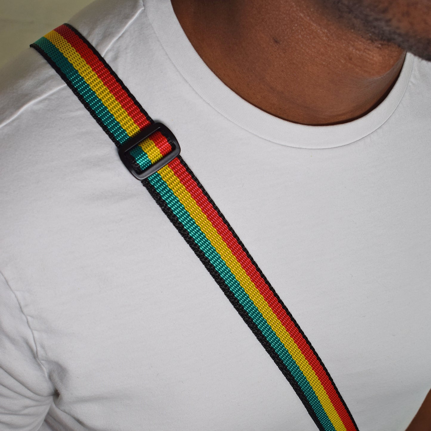 man wearing the 25mm shoulder strap over the shoulder